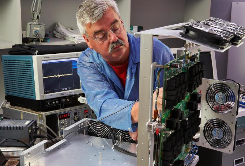 Calibration technician working on equipment.